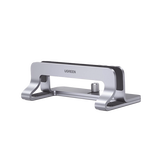 Soporte Vertical para Laptop / Adecuado para escritorio / Anchura Ajustable (12-26mm) / Amplia compatibilidad / Anti-Arañazos / Anti-Deslizante /Ajustable Mediante Tornillos / Color Plata / Aluminio +